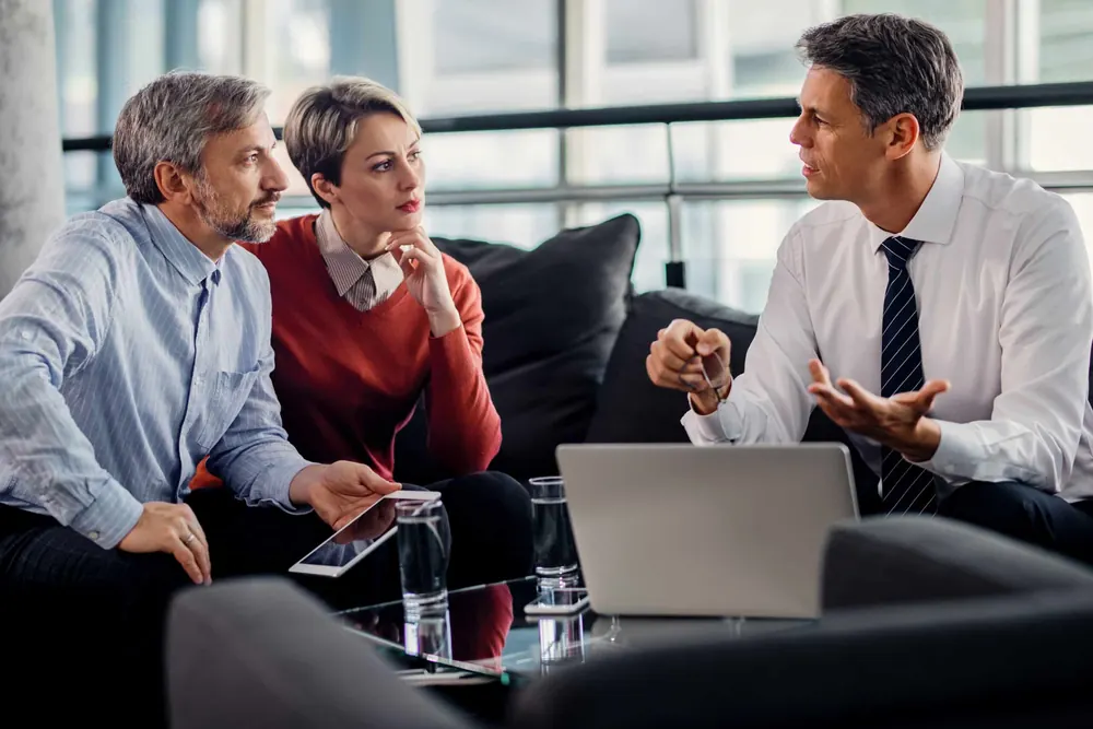 Kinney Agency agent reviewing coverage options with a couple